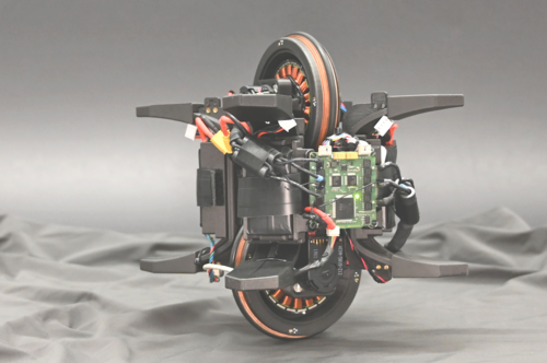 The Wheelbot: A Jumping Reaction Wheel Unicycle
